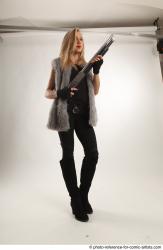 NIKOL STANDING POSE WITH SHOTGUN